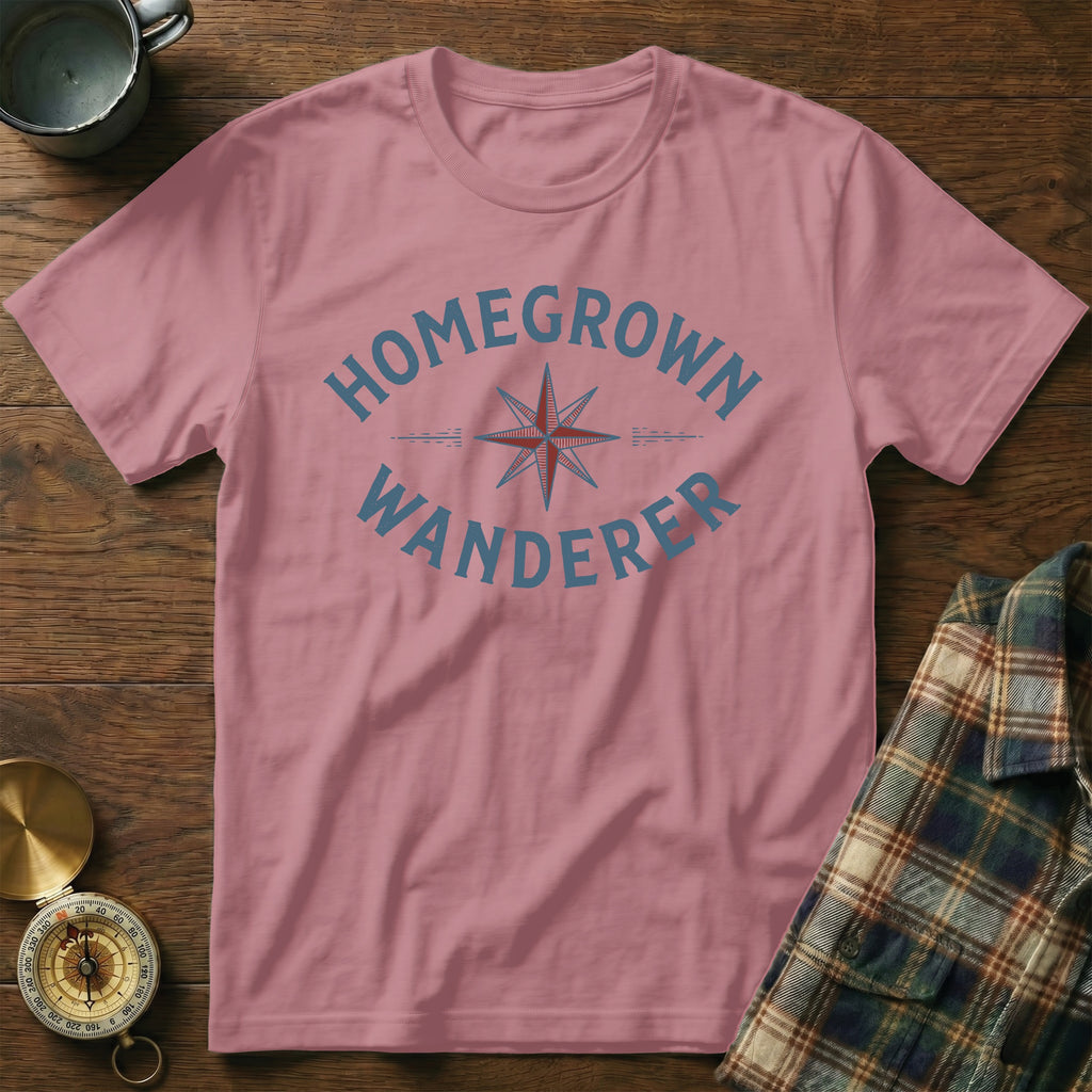 Pink t-shirt with "Homegrown Wanderer" text and compass graphic.