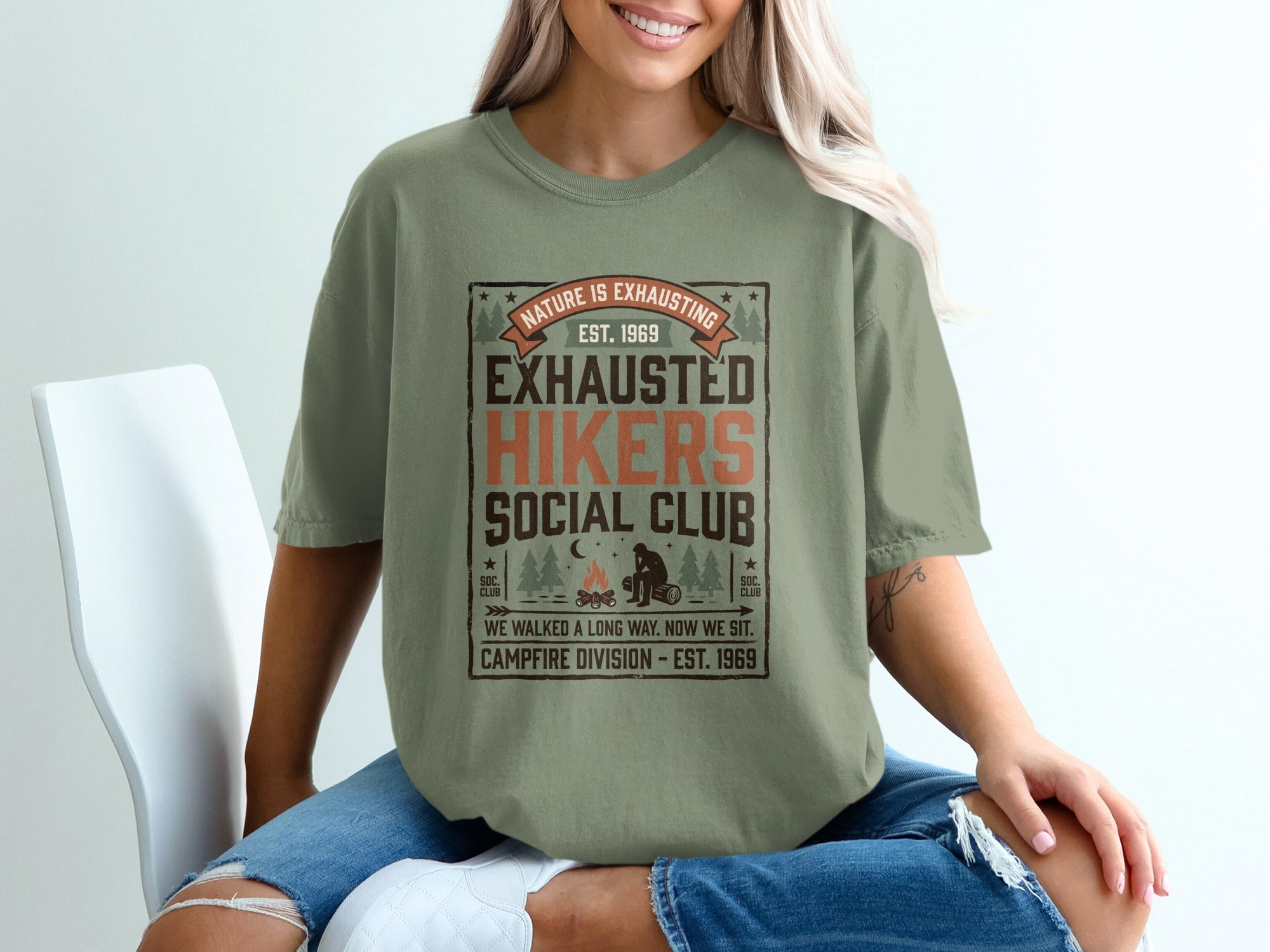 Olive green t-shirt with distressed "Exhausted Hikers Social Club" graphic and campfire.