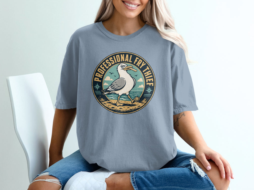 Round graphic of a seagull with a french fry in its beak, text "PROFESSIONAL FRY THIEF".