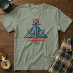 T-shirt with blue anchor and sun over mountains graphic.