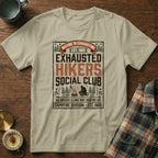 "Nature is Exhausting" slogan t-shirt with campfire and hiker graphic.