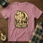 Pink t-shirt with graphic of turtle and text "SLOW IS THE WHOLE POINT".