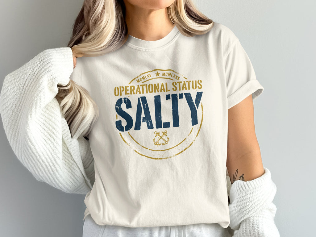 Cream t-shirt with "SALTY" in blue and gold nautical design.