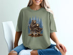Bear sitting in a chair with coffee in front of pine trees.