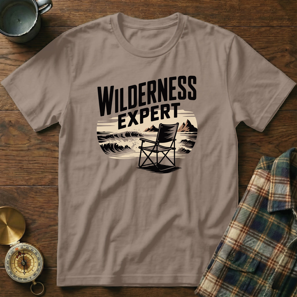 T-shirt with "WILDERNESS EXPERT" text and a beach chair scene.