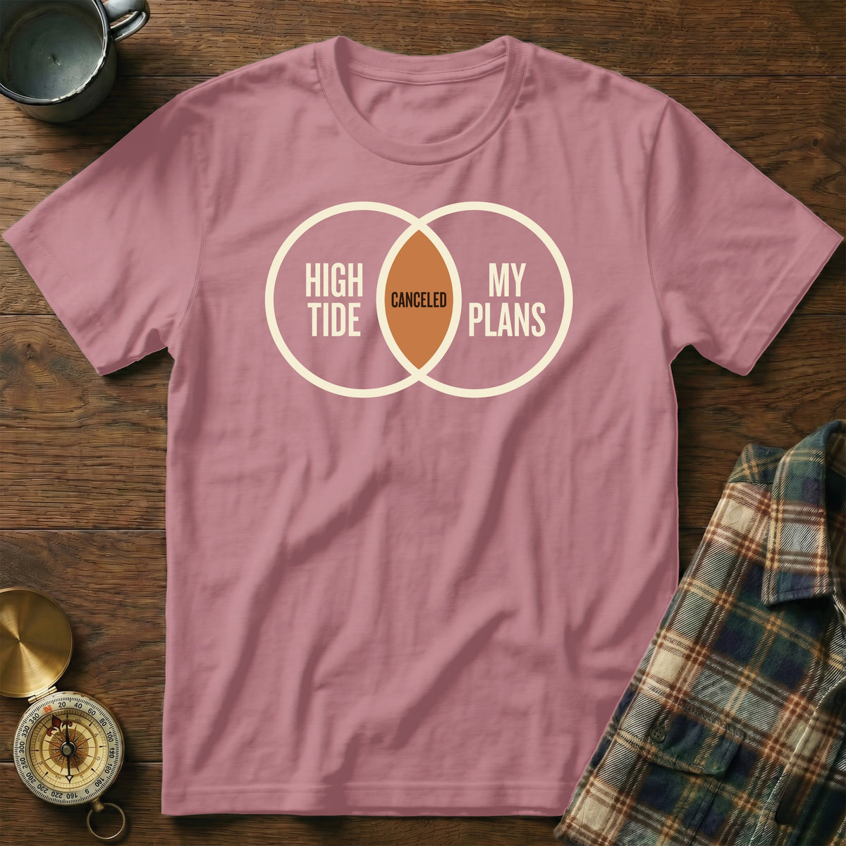 Pink t-shirt with a Venn diagram graphic reading "High Tide" and "My Plans" with "Canceled" in the overlap.