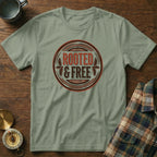 Light sage t-shirt with "ROOTED & FREE" graphic in a circular emblem.