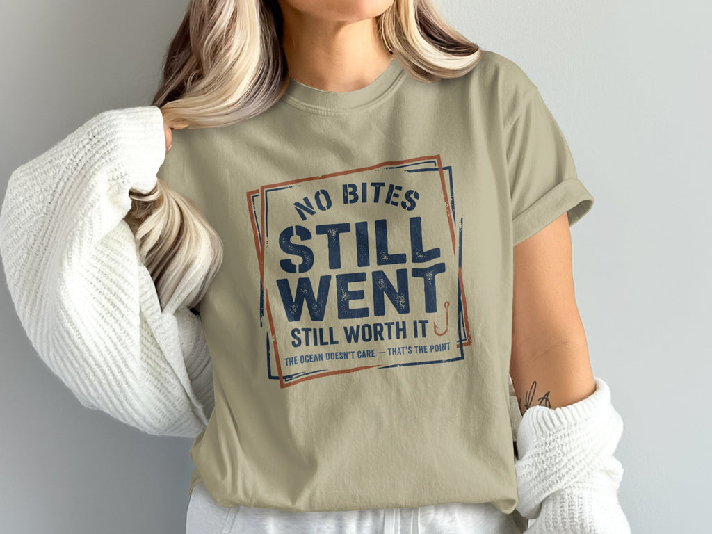 Tan t-shirt with blue and red text: "NO BITES STILL WENT STILL WORTH IT".