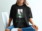 Black t-shirt with a phone graphic featuring a mountain, river, and trees.