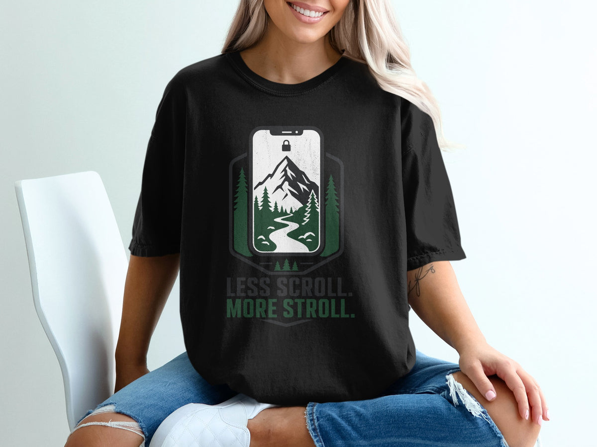 Black t-shirt with a phone graphic featuring a mountain, river, and trees.