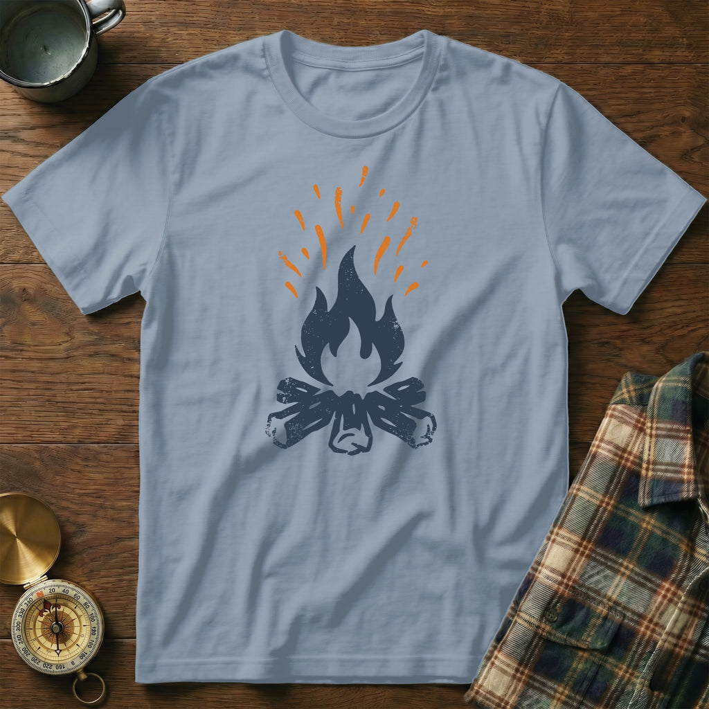 Light blue t-shirt featuring a dark grey campfire graphic with orange flames.