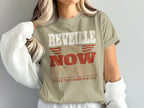A person wearing an olive-green t-shirt printed with the text REVEILLE IS NOW OPTIONAL EFFECTIVE IMMEDIATELY.