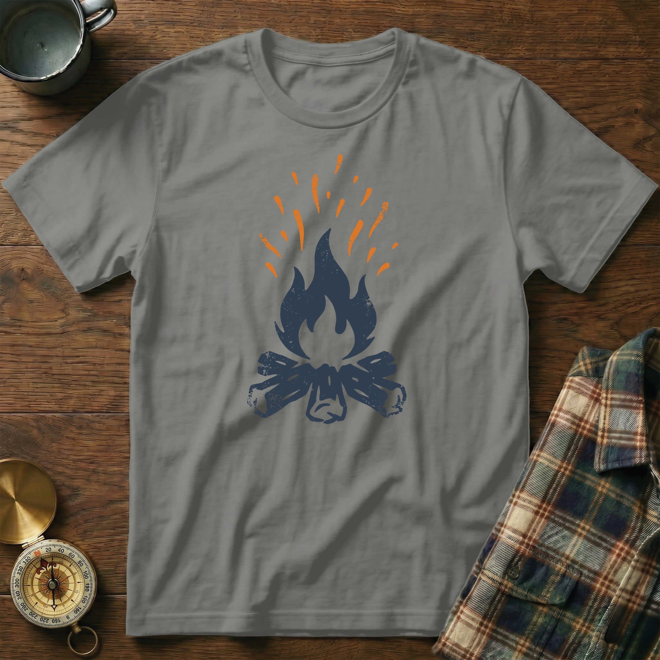 T-shirt with a stylized graphic of a campfire and flames.