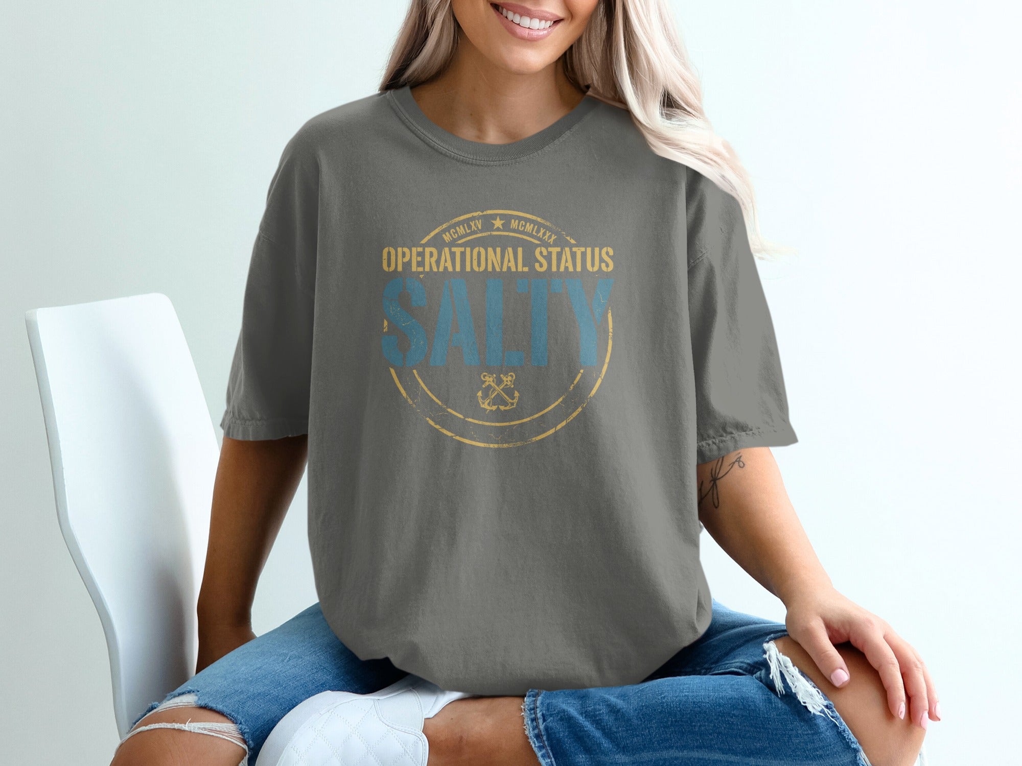 Grey t-shirt with distressed "Operational Status: Salty" text and nautical emblem.