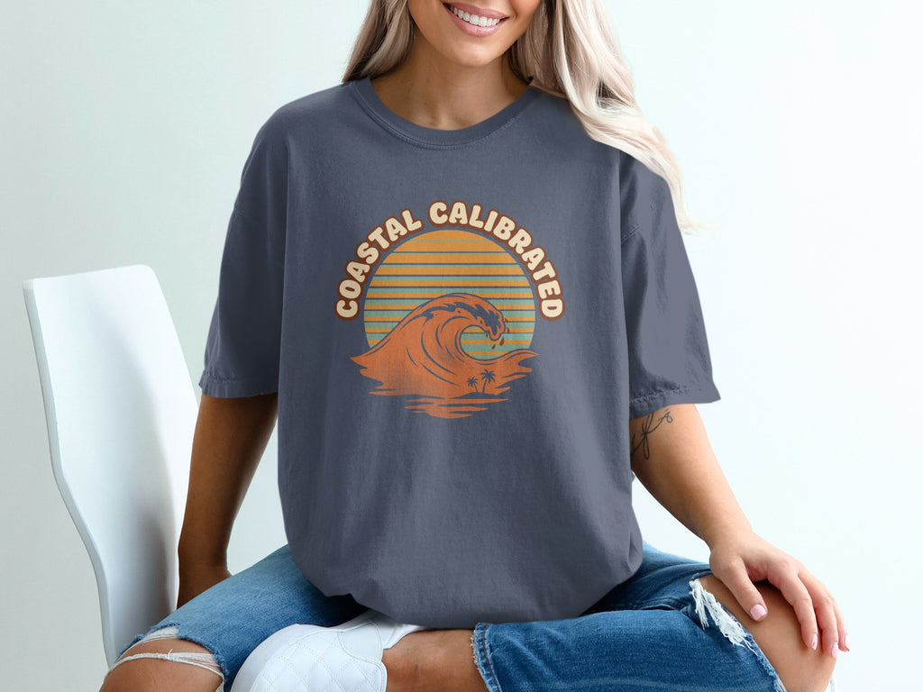 T-shirt with "Coastal Calibrated" text and a wave graphic.