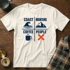 White t-shirt with "Coast Mountains Coffee People" and icons: wave, mountain, coffee cup, x.