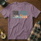 Purple t-shirt with "From Summit to Sea" graphic and mountain, wave, and sun design.