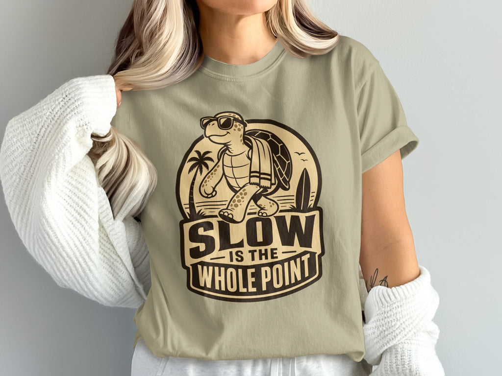 T-shirt graphic features a turtle wearing sunglasses and text "SLOW IS THE WHOLE POINT".