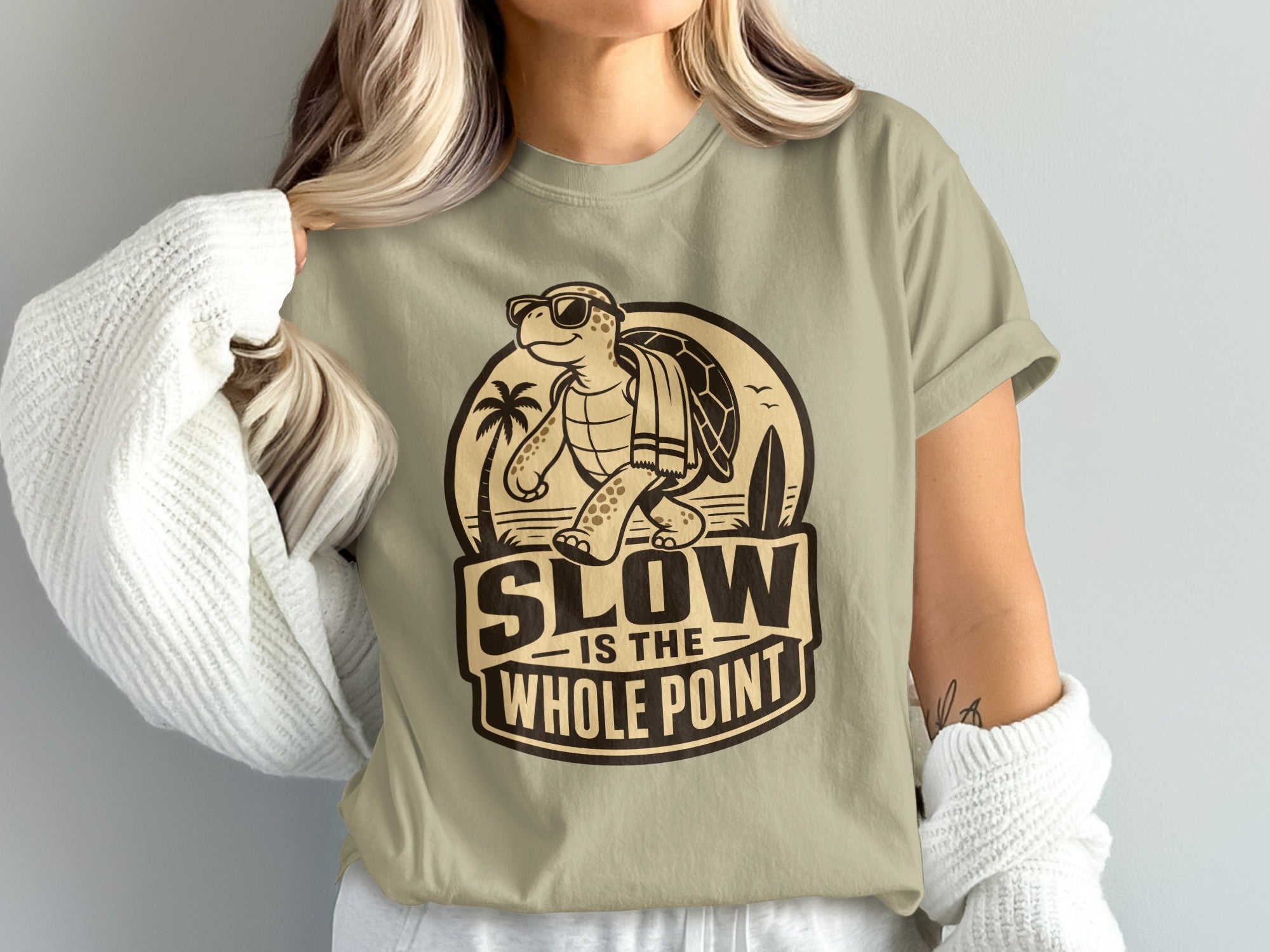T-shirt graphic features a turtle wearing sunglasses and text "SLOW IS THE WHOLE POINT".
