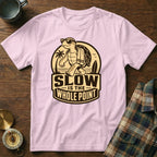 Pink t-shirt with cartoon turtle, sunglasses, towel, and text "SLOW IS THE WHOLE POINT".