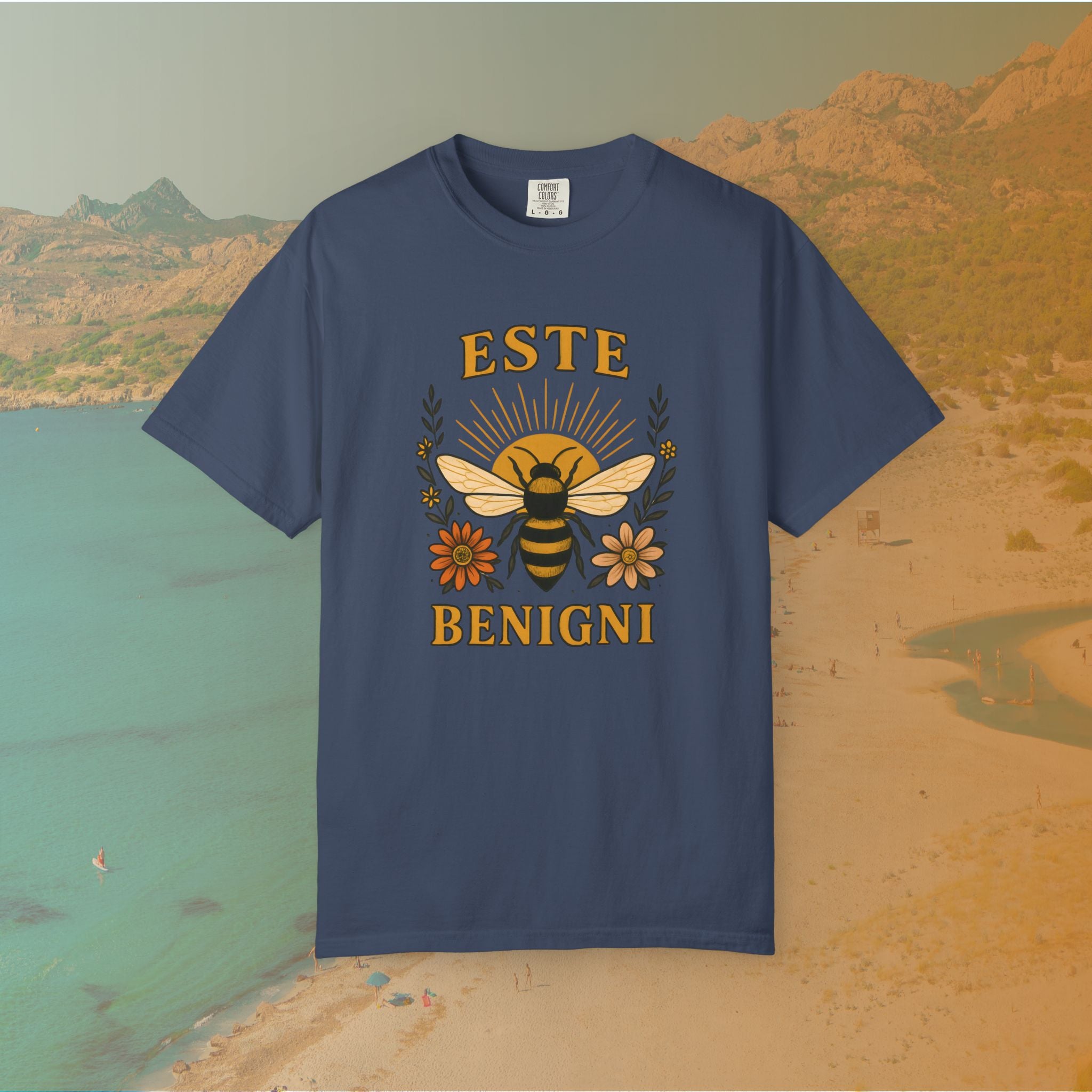 navy blue t-shirt Vintage-style graphic tee featuring a large, central honey bee with sunburst wings, flanked by retro flowers. The Latin words "ESTE BENIGNI" for "BEE KIND" are printed above and below the design.