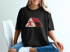 Black t-shirt with red and beige graphic of a runner and a bear.