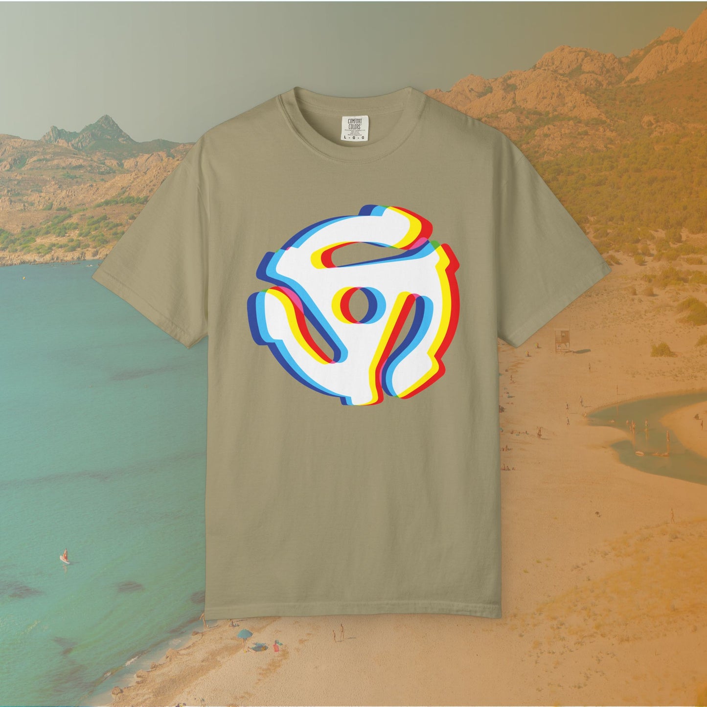 khaki t-shirt with a graphic of a white 45 RPM vinyl record adapter (dink) with a red, yellow, blue, and cyan chromatic aberration/glitch effect, ready for EDM festival apparel