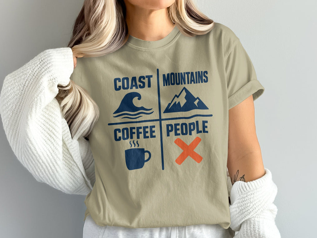 Tan t-shirt with "Coast Mountains Coffee People" design and icons.