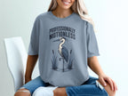 T-shirt with "Professionally Motionless" text and a heron standing in water.