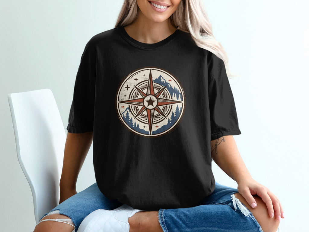 Black t-shirt with circular vintage compass design featuring mountains and trees.