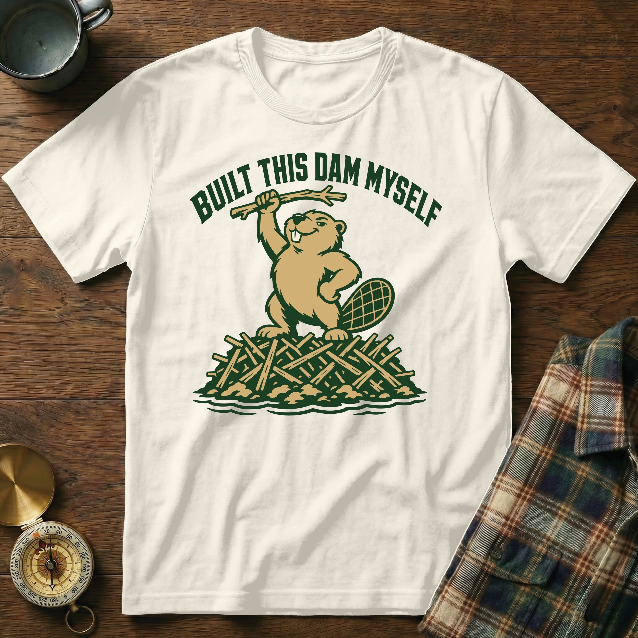 White t-shirt with a beaver illustration and "BUILT THIS DAM MYSELF" text.