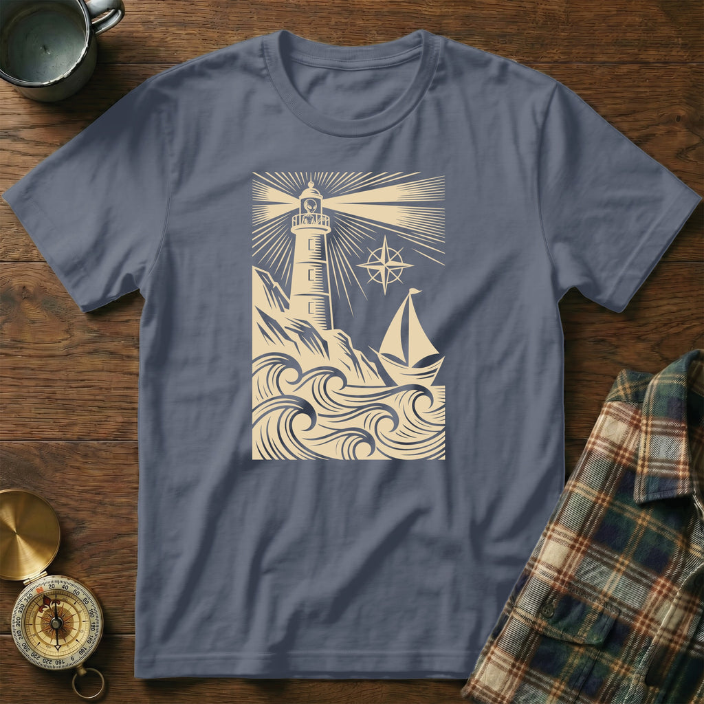 T-shirt featuring a lighthouse and sailboat illustration with stylized waves.