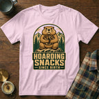 Groundhog on a rock holding nuts with "Hoarding Snacks Since Birth" text.