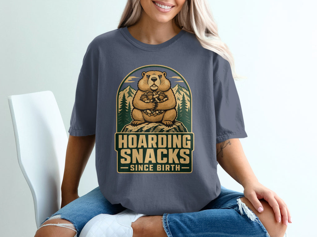 Groundhog hoarding nuts with text "Hoarding Snacks Since Birth".