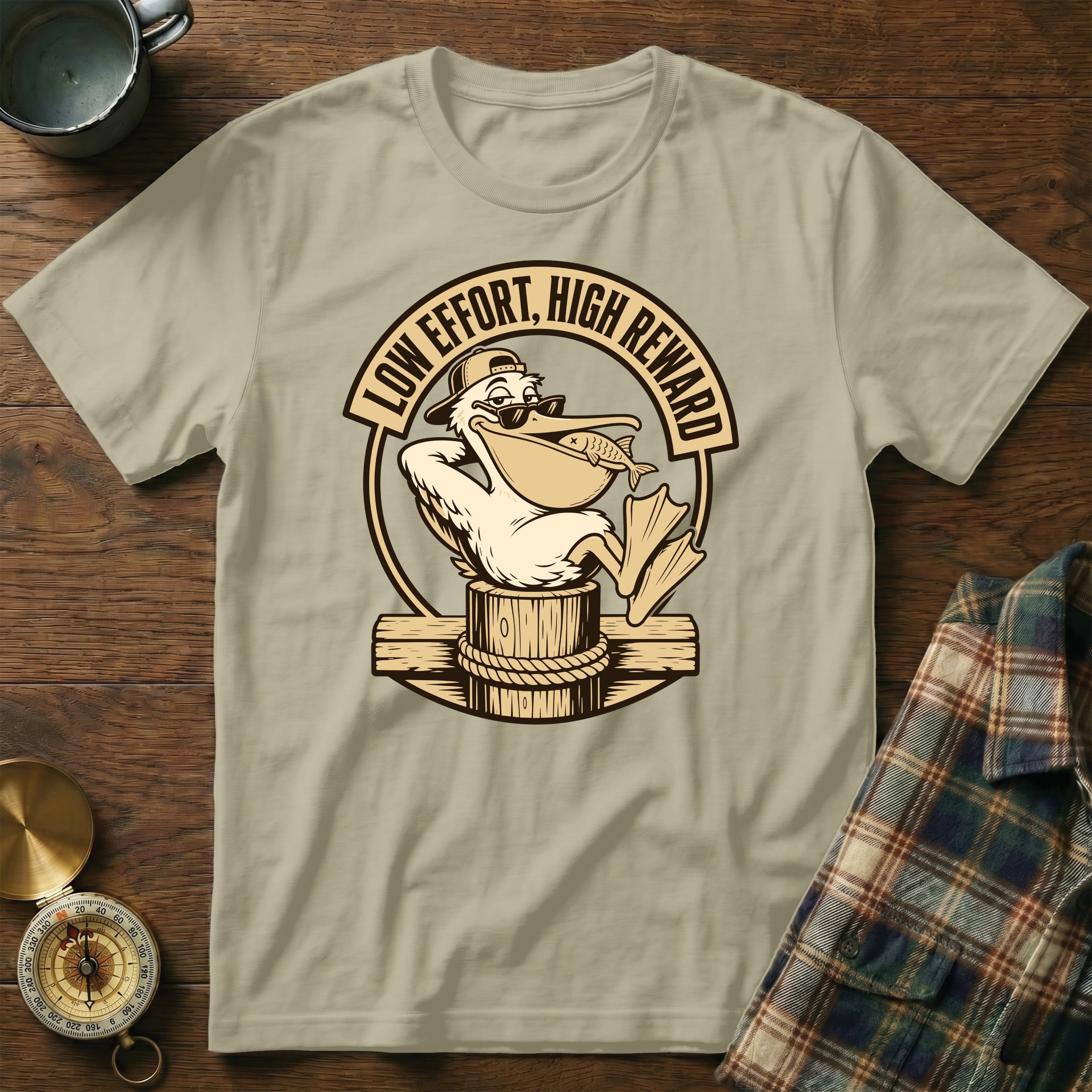 Pelican wearing sunglasses holding fish with text "LOW EFFORT, HIGH REWARD".