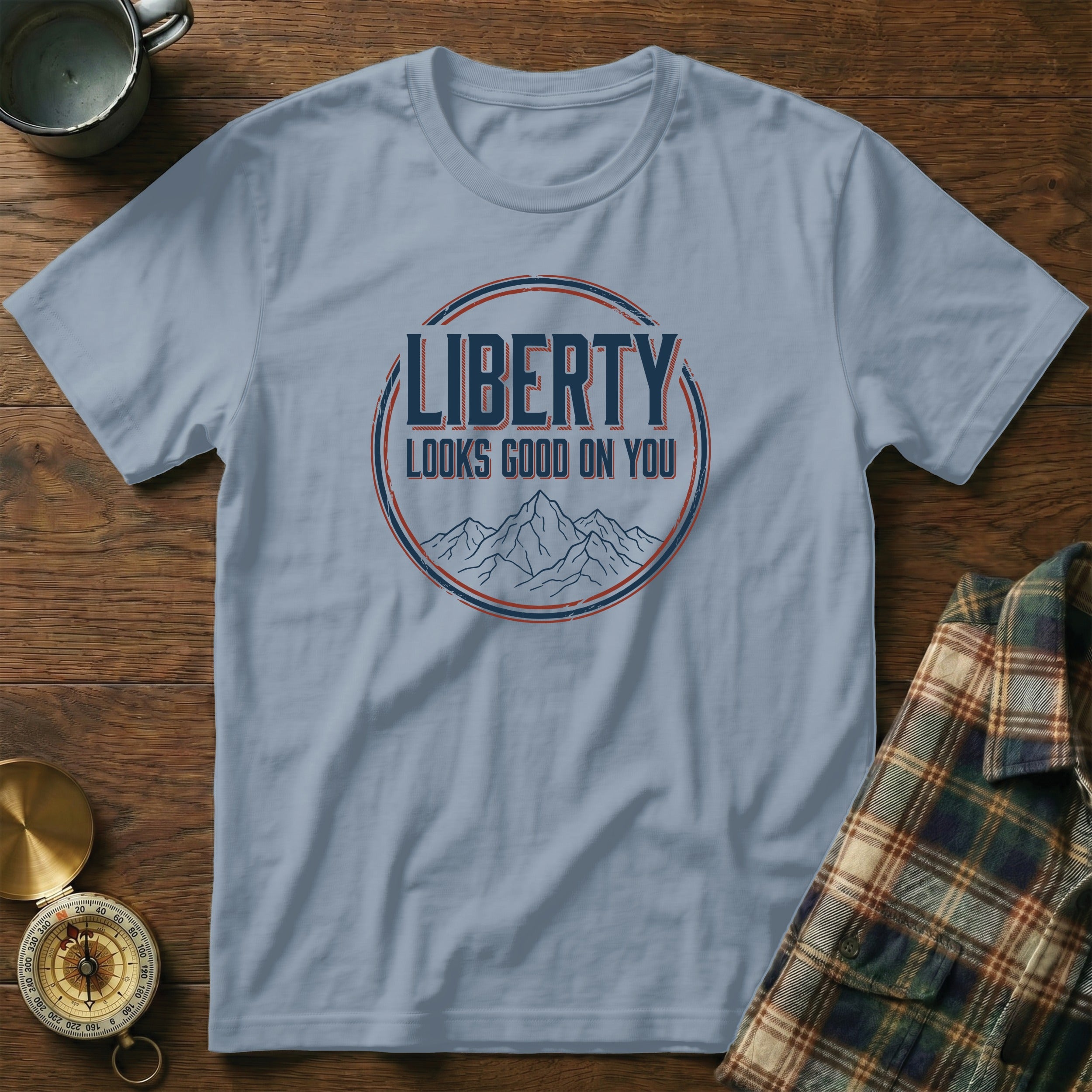Light blue t-shirt with "LIBERTY LOOKS GOOD ON YOU" graphic.