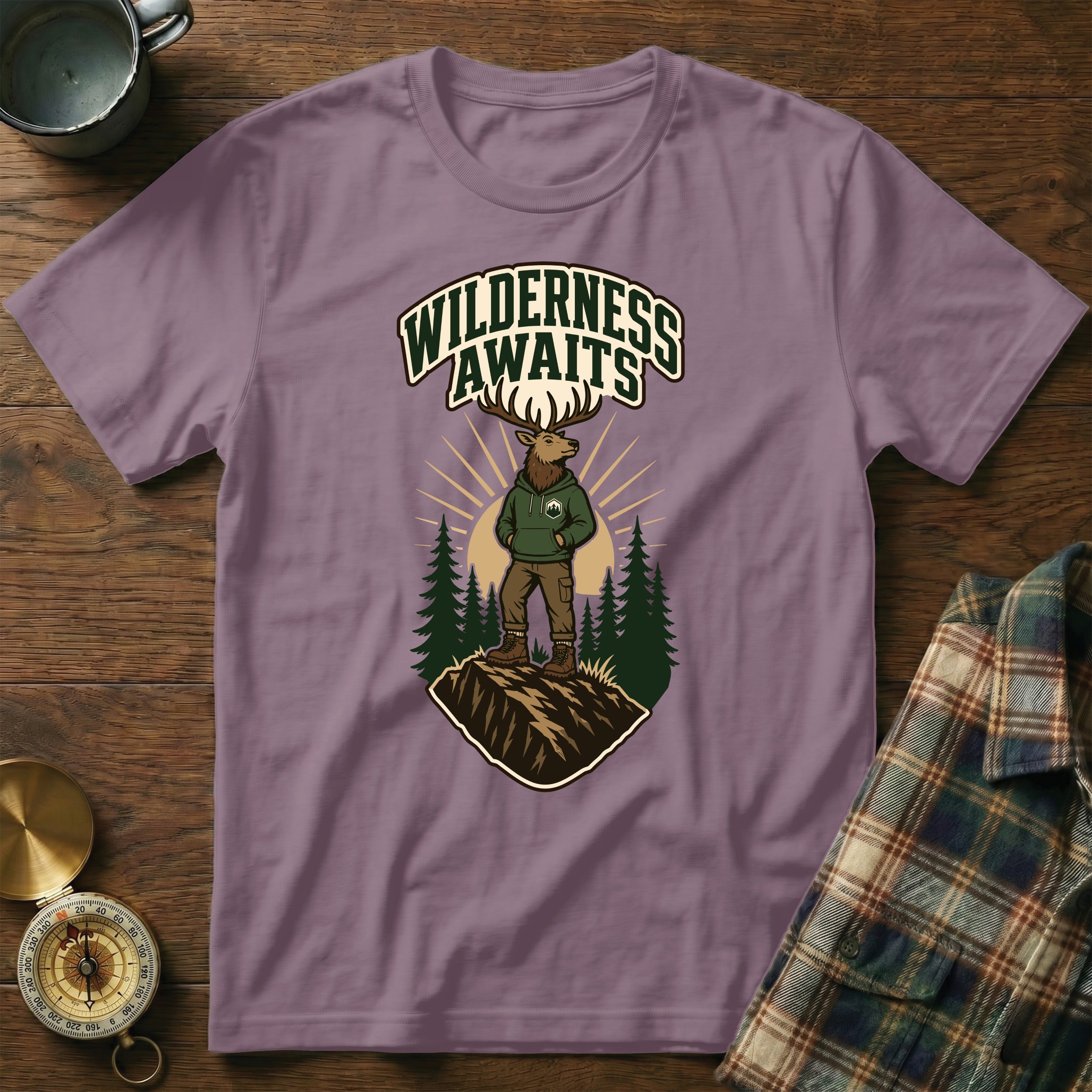 Purple t-shirt with deer in hoodie and text "WILDERNESS AWAITS".