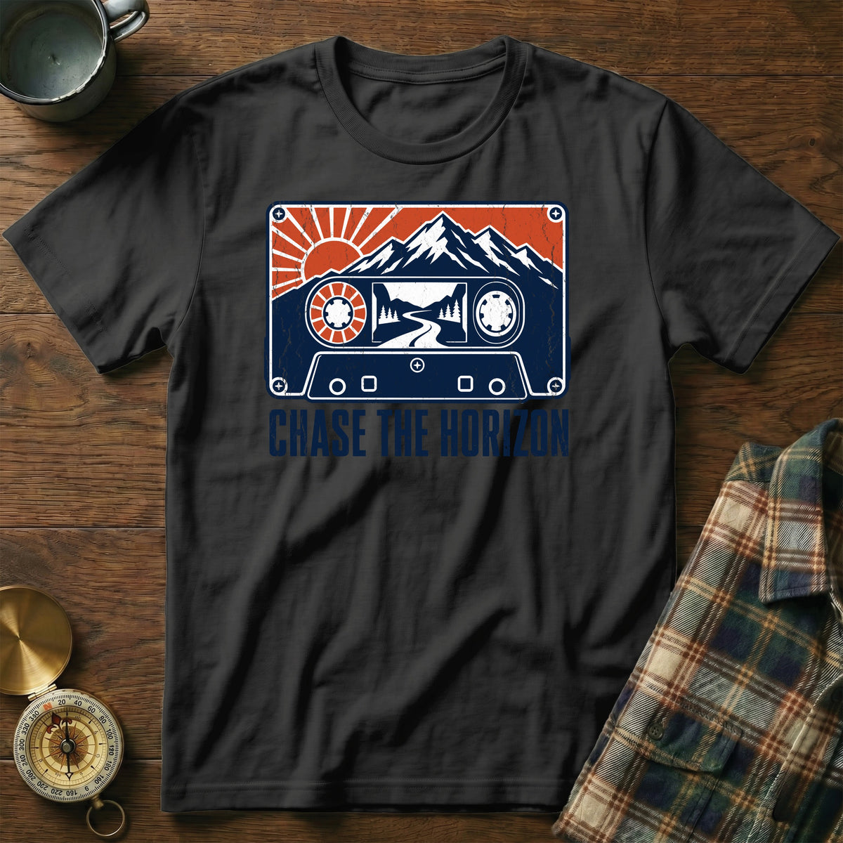 Black t-shirt featuring a retro cassette tape graphic with mountains and sun, plus Chase The Horizon text.