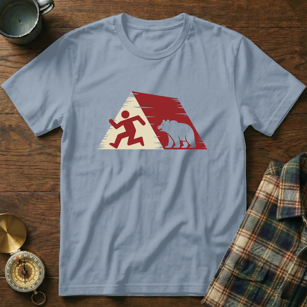 Light blue t-shirt with graphic of running person and bear inside a red and white triangle.