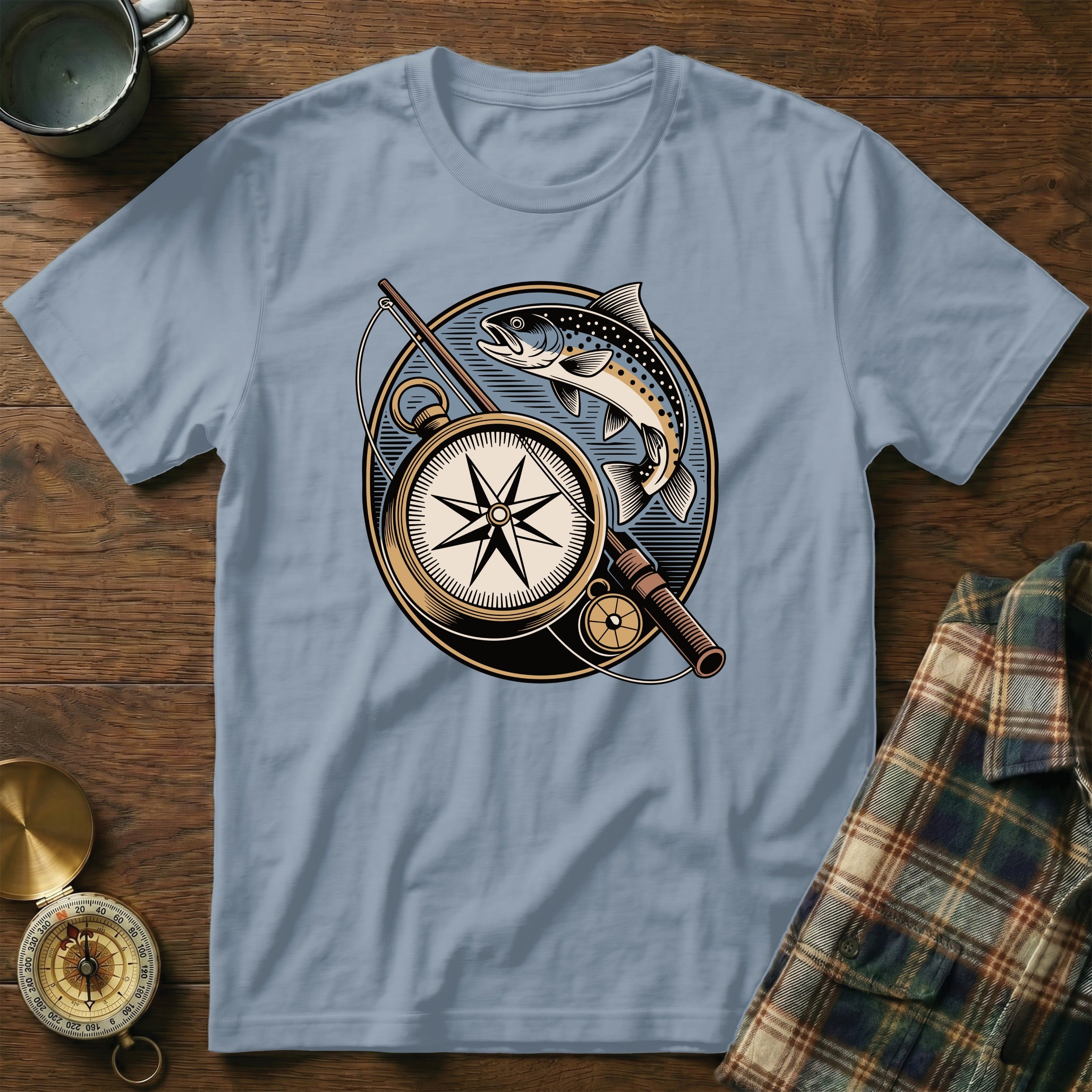 Light blue t-shirt with compass, fishing rod, and fish graphic.