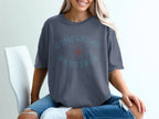 Dark grey t-shirt with "HOMEGROWN WANDERER" text and compass graphic.