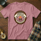 "Adult Conversation" merit badge t-shirt with "Est. 1969" and campfire graphic.