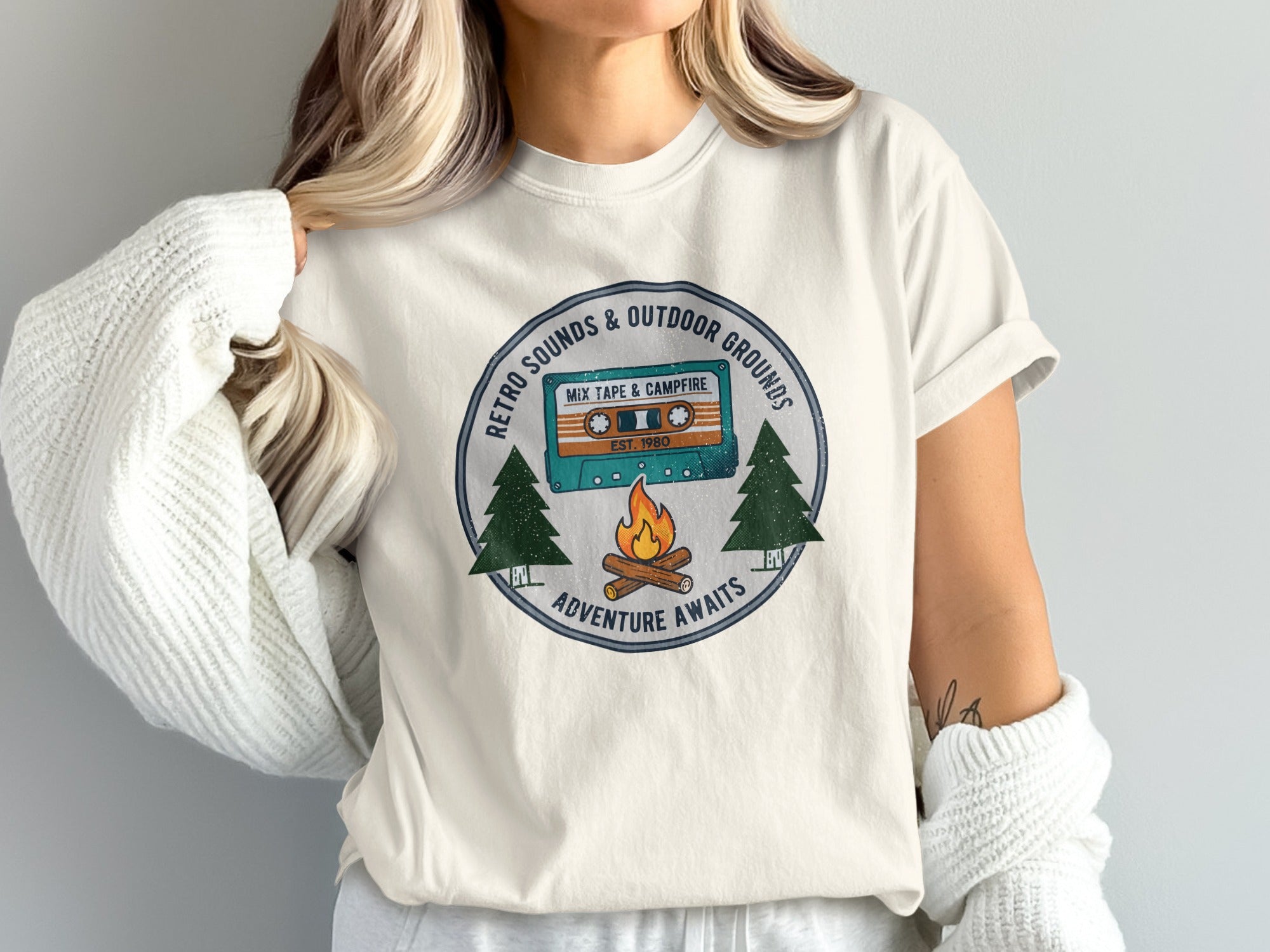 T-shirt with retro mixtape, campfire, and trees graphic.