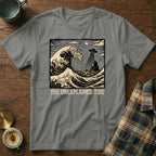 The Unexplained Tide t-shirt features a UFO hovering over waves and a rocky island.