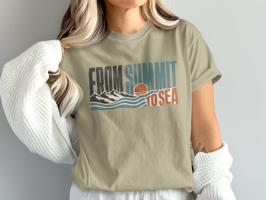 T-shirt with "FROM SUMMIT TO SEA" text, mountains, waves, and sunset graphic.