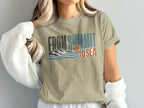 T-shirt with "FROM SUMMIT TO SEA" text, mountains, waves, and sunset graphic.