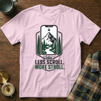 Pink t-shirt with "Less Scroll. More Stroll." text and mountain graphic.