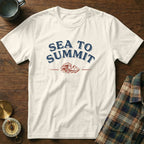 Cream t-shirt with "SEA TO SUMMIT" text and wave/mountain graphic.