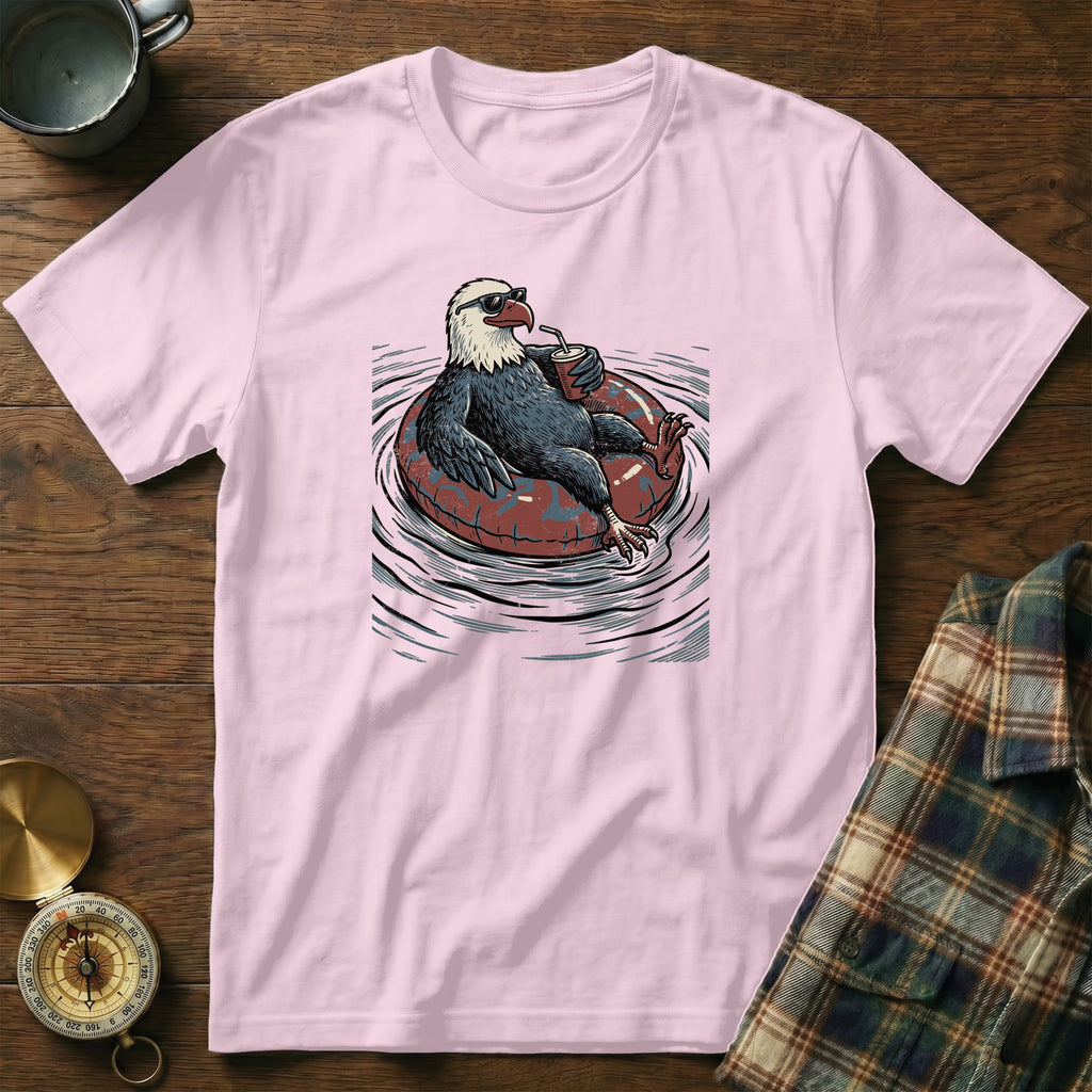 Eagle wearing sunglasses relaxes in an inner tube with a drink.