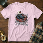 Eagle wearing sunglasses relaxes in an inner tube with a drink.